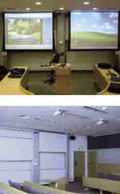 ”A typical classroom at Singapore
Management University: two networkconnected
projectors, two whiteboards
with several individual boards, two
loudspeakers, playback media (DVD , VCD,
video), a fixed computer and a visualisation
medium (document camera). The electronic
equipment is controlled via a standardised
touch panel so the teacher does not have to
adapt to different technology in each room.
In addition, a technical support team has
been established to assist the teachers if any
problems occur in connection with the use of
the technology in the classroom.