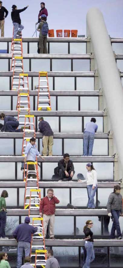 Students help each other greening a roof at
Harvard University